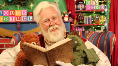 Santa reading to friends at the House of Kringle